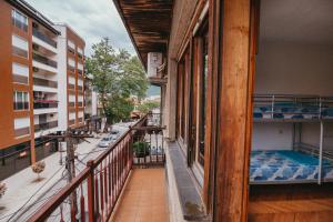 a balcony of a building with bunk beds on it at Sunset Lake hostel in Ohrid