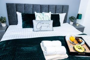 a tray of food on a bed with a breakfast on it at TD-Stourb DUDLEY 3 Bed House-PERFECT FOR CONTRACTORS-FAMILIES-LONG & SHORT STAY in Woodside