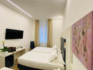 TV a/nebo společenská místnost v ubytování Hotel Fioralba