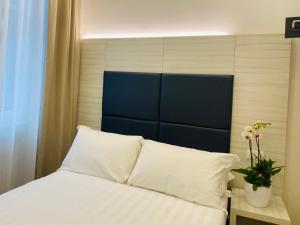 Postel nebo postele na pokoji v ubytování Hotel Fioralba