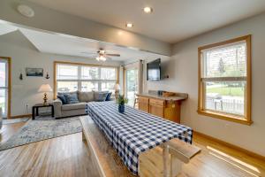 a living room with a bed and a couch at Cottage in Edinboro Walk to Pat Crawford Beach! in Edinboro