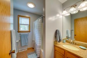a bathroom with a sink and a shower at Walk to Beach, Lake Edinboro Views Camp Dickson in Edinboro +19 photos