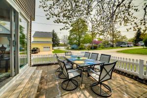 a patio with a table and chairs on a porch at Cottage in Edinboro Walk to Pat Crawford Beach! in Edinboro