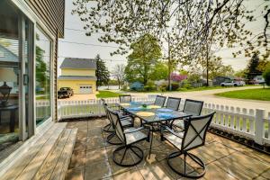a patio with a table and chairs on a porch at Walk to Beach, Lake Edinboro Views Camp Dickson in Edinboro