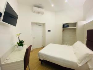 Postel nebo postele na pokoji v ubytování Hotel Fioralba