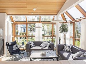 a living room with two couches and a table at 8 person holiday home in Skagen in Skagen