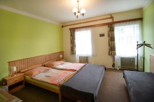 Postel nebo postele na pokoji v ubytování Ubytování u Nováků