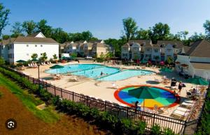 a large swimming pool at a resort at King's Creek Plantation in Williamsburg