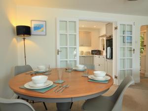 a wooden table in a kitchen with a dining room at Ferry View in Dartmouth