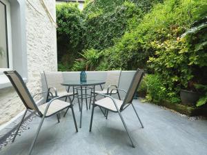 a table and chairs sitting on a patio at Ferry View in Dartmouth