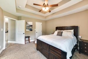 a bedroom with a bed and a ceiling fan at Family-Friendly Home 9 Mi to Clarksville Speedway in Clarksville