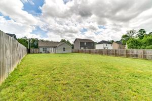 a large yard with a fence and houses at Family-Friendly Home 9 Mi to Clarksville Speedway in Clarksville