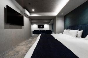 Postel nebo postele na pokoji v ubytování Randor Hotel Hiroshima Prestige