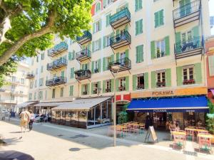 a street in a city with a building at Grimaldi Centrale 5 Pers Wi-Fi AC in Nice