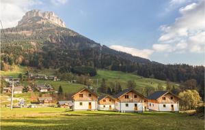 a village with a mountain in the background at Cozy Home In Altaussee With Sauna in Altaussee