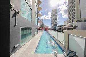a swimming pool on the side of a building at BB on the Park 504 in Gold Coast