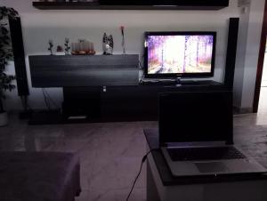 a laptop sitting on a desk with a computer monitor at Chalet Costa Dorada in Tarragona