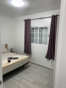 a bedroom with a bed and a window at CASA PARAISO 3 in Corralejo