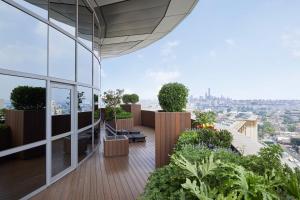 a view from the balcony of a building with plants at JW Marriott Hotel Beijing Central in Beijing