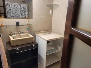 a small bathroom with a sink and a counter at Monoambiente amplio, Centrico in Santa Rosa
