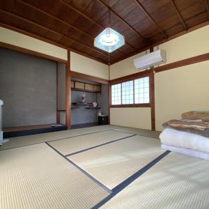 a room with a large rug on the floor at Abuden in Kumano for women and families 女性と家族専用の宿 in Kumano