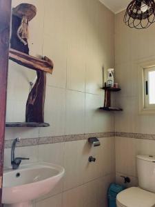 a bathroom with a sink and a toilet at Luna House Lighthouse in Dahab