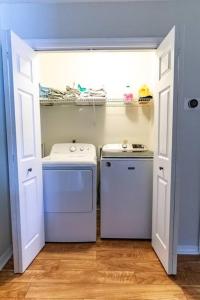 a small laundry room with a washer and dryer at Spacious Family Hideaway on the Emerald Coast! in Panama City Beach