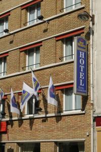a group of flags on the side of a building at Maison 46 in Paris