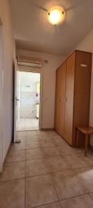 an empty room with a large room with a hallway at Apartments Ana i Ante Punta in Milna