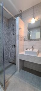 a bathroom with a sink and a shower at Apartments Ana i Ante Punta in Milna