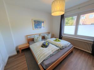 Katil atau katil-katil dalam bilik di Ferienhaus Nordlicht