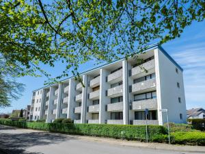 an apartment building on a street at Sol Mare 25 Ostseezeit in Kellenhusen