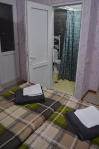 Ein Bett oder Betten in einem Zimmer der Unterkunft Alex's Cosy Guesthouse
