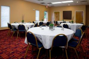 a conference room with tables and chairs with white table cloth at Fairfield Inn & Suites by Marriott San Antonio Downtown/Market Square in San Antonio