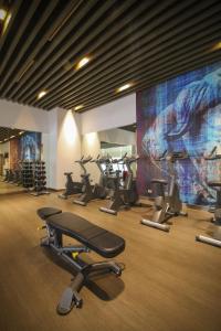 a gym with a bunch of exercise bikes in a room at The Mini Suites Eton Tower Makati in Manila