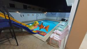 a small swimming pool with a slide and a slide at Family POOL VILLA CHAAM in Cha Am