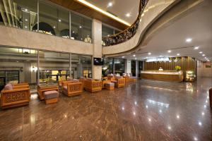 a lobby with couches and chairs in a building at Sekong Hotel Da Nang in Da Nang