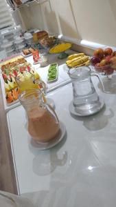 a kitchen counter with a blender and food on it at Hotel Paris in São Paulo