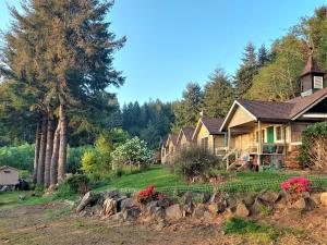 a group of houses and a yard with rocks at Siltcoos Station in Siltcoos