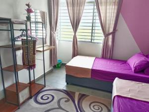 a bedroom with two beds and a window at DG HomestayMuslim Putrajaya - Near Alamanda in Putrajaya