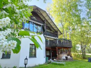 an exterior view of a house with a balcony at Cronin's Guesthouse Bed & Breakfast in Heinola