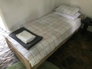 a bed with a pillow on top of it at Jarmenovci Glamping Resort in Jarmenovci