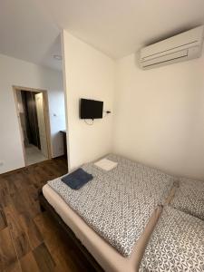 Postel nebo postele na pokoji v ubytování Beregi Apartman