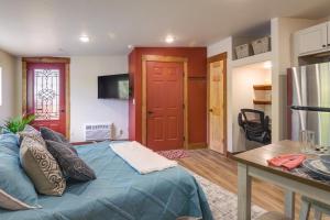a bedroom with a blue bed and a red door at Southern Colorado Rental 10 Mi to Mesa Verde in Cortez