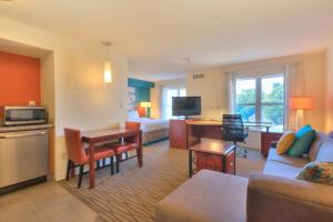 a hotel room with a living room with a couch and a bed at Residence Inn Atlanta Buckhead/Lenox Park in Atlanta