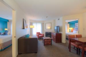 a hotel room with a bed and a living room at Residence Inn Atlanta Buckhead/Lenox Park in Atlanta