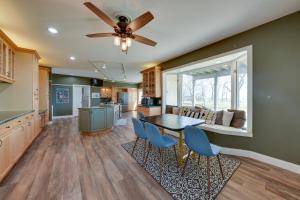 a kitchen and dining room with a table and chairs at Lake Michigan Vacation Rental with Private Beach! in Racine