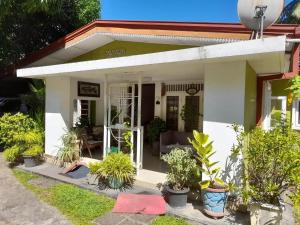 a house with a lot of plants in front of it at Devi Tourist Home in Polonnaruwa