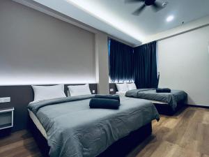 A bed or beds in a room at LAVIE HOTEL & APARTMENT