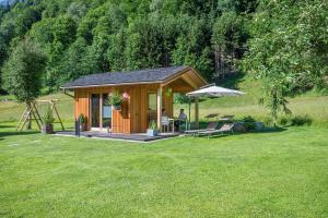Vonkajšia záhrada v ubytovaní Alpenherz Apartments